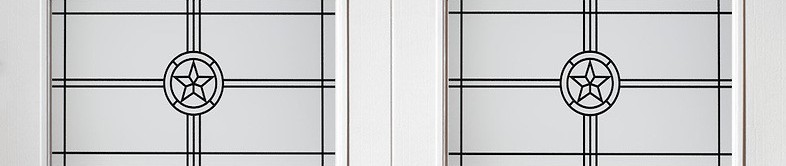 White garage door windows with decorative black star and circle grid inserts.