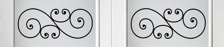 White garage door windows with decorative black scrollwork inserts and clear glass.