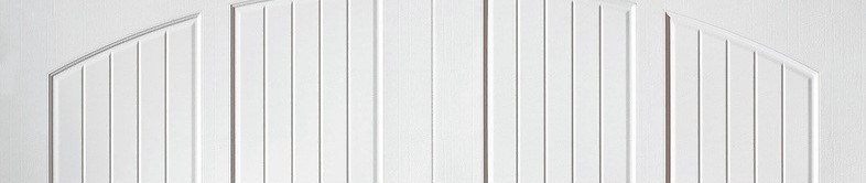 White arched garage door panels with vertical beadboard grooves.