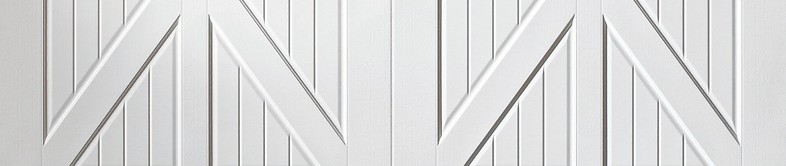 White Carriage House door with cross-buck panels and an arched top design.